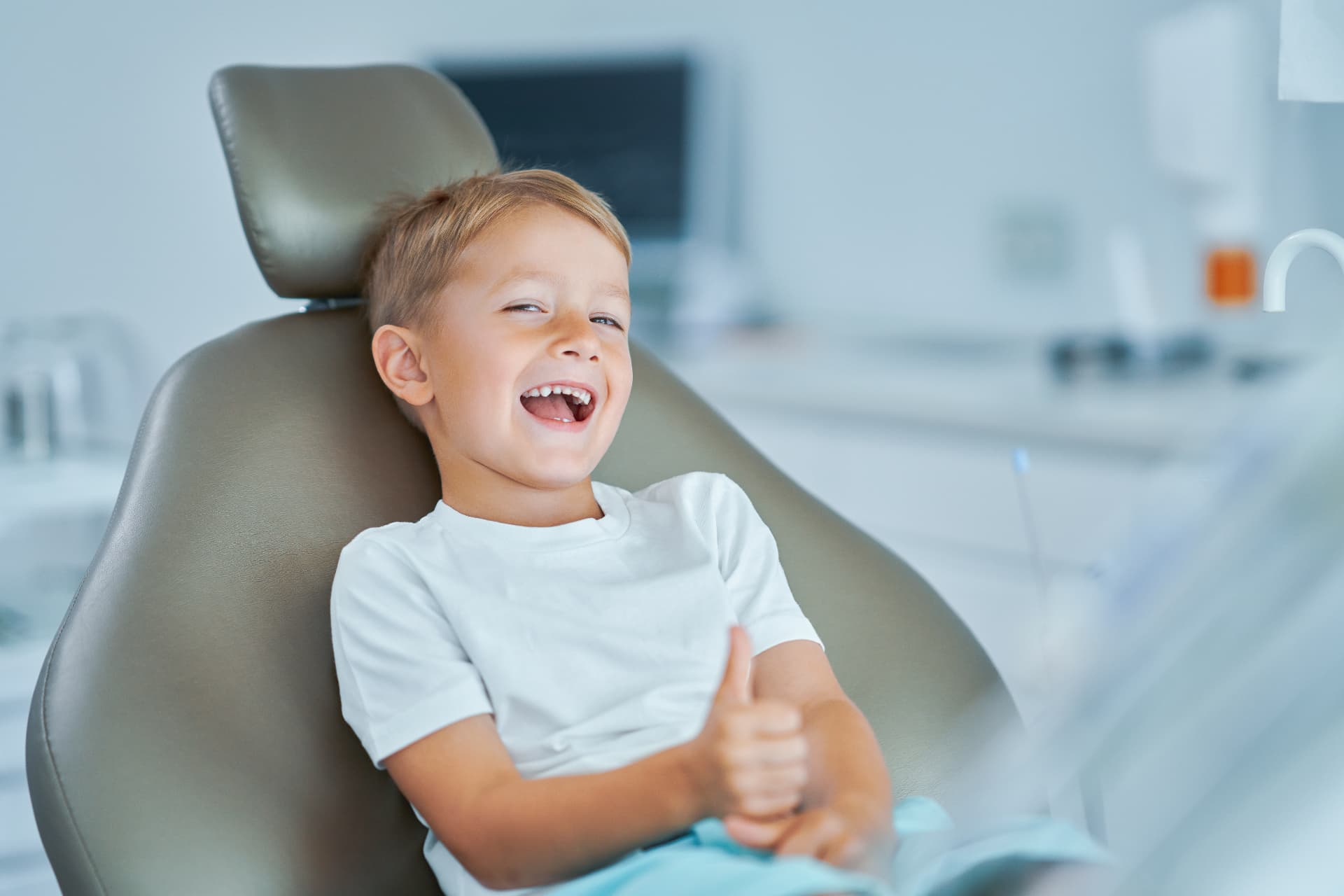 A young patient smiling during a checkup