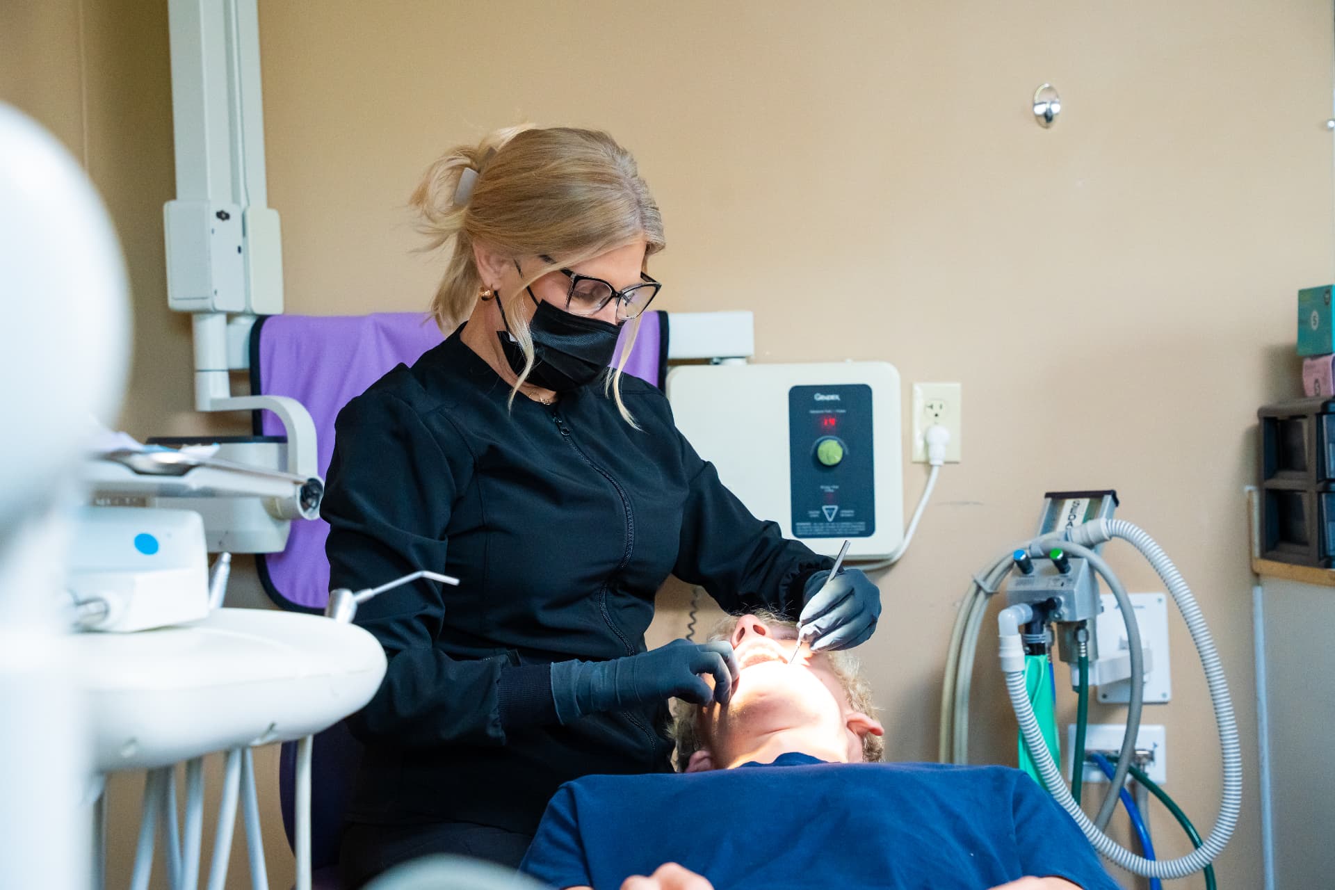 Dentist caring for a patient during treatment